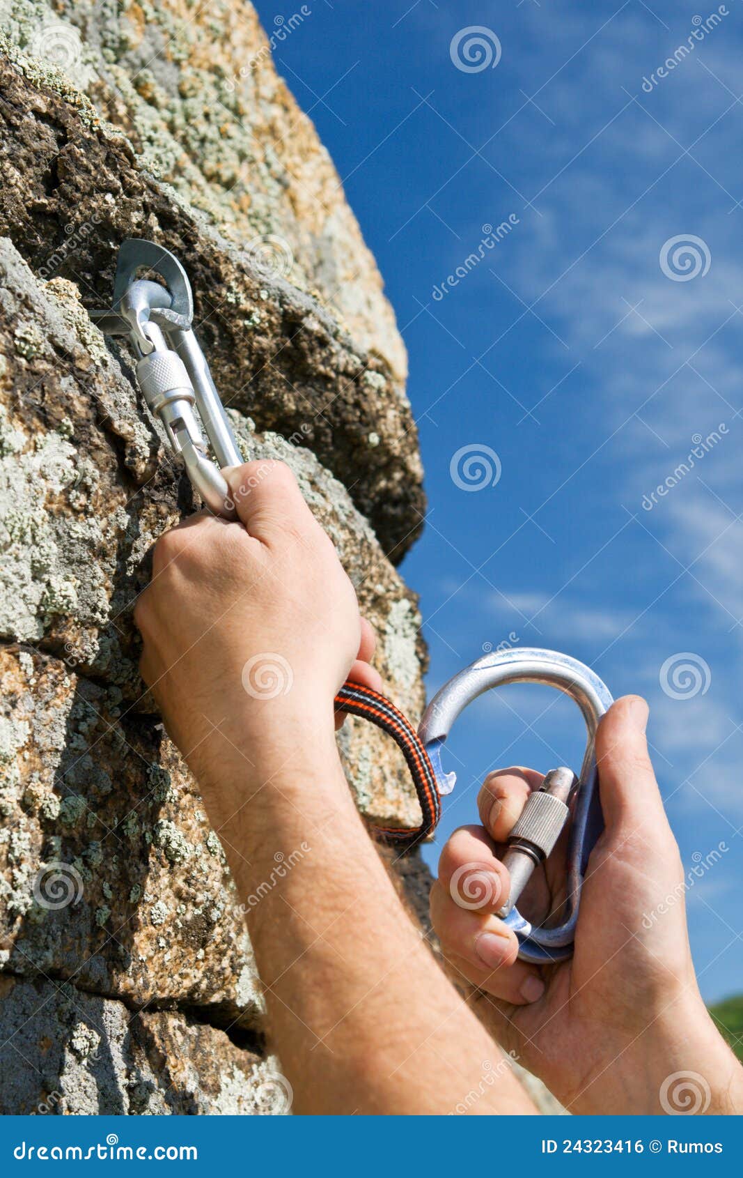 Two Hands of Climber Fix Equipment on Rock Stock Photo - Image of